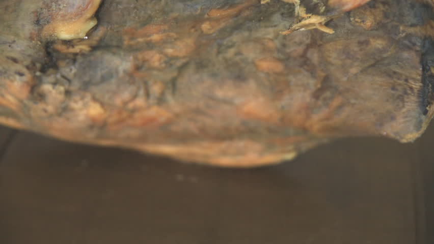 Side view of serrano ham over wood