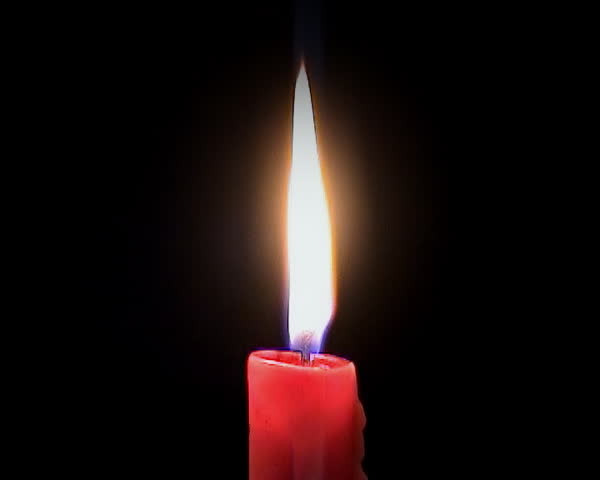 Burning candle that is blown out and keeps smoking for a while - close-up, with sound.