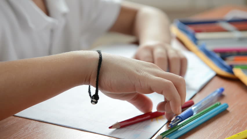 Child draws crayons. Dolly shot. Full HD video
