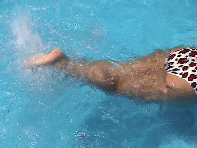 Woman relaxing in the swimming pool