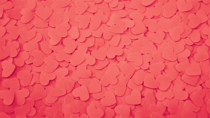 Romantic background with handmade paper hearts.