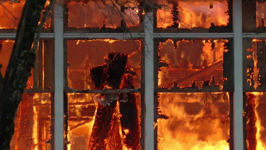 BATTLE GROUND, WASHINGTON - JANUARY 21: Flames consuming the old public high school building during a controlled burn by the local fire department in Battle Ground, Washington on January 21, 2012