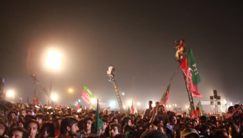LAHORE, PAKISTAN - OCTOBER 30: Thousands of supporters attend a rally held by former cricketer turned politician Imran Khan's party Pakistan Tehreek-E-Insaf in Lahore, Pakistan on October 30, 2011.