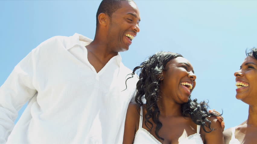Diverse daughter laughing and chilling with parents on video postcard