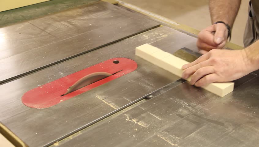 cross cutting a board on a table saw