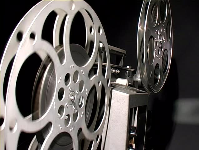 Film Projector Reels Turning Behind Stock Footage Video (100% Royalty-free)  31102