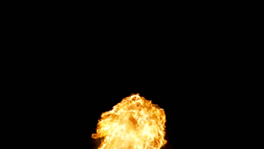 Almost like a fountain of flame, rolling bursts of fire rush upwards in slow motion against black.