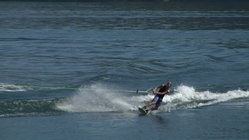 COMO LAKE, ITALY: A young man jumps the wake behind a boat during the "Wakeboard Tour Lario" on 15 september 2012, Como Lake (Italy)