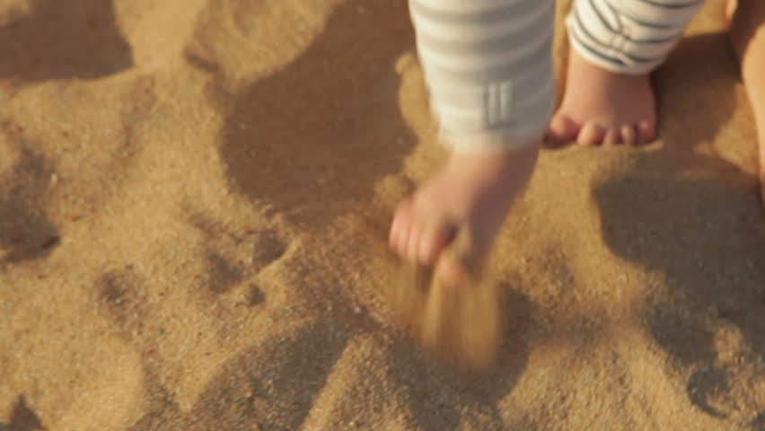 Baby first steps (close-up of feet)