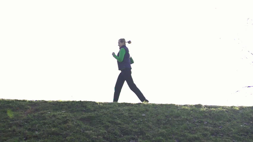 Man and woman jogging outdoors, super slow motion, shot at 480fps
