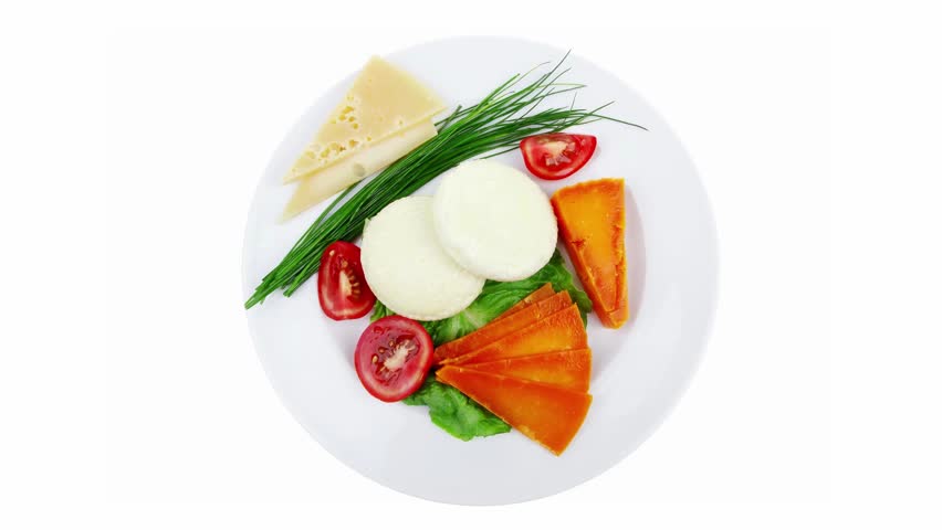 aged cheese : parmesan roquefort and gruyere chops delicatessen cheeses and soft feta on plate isolated over white background