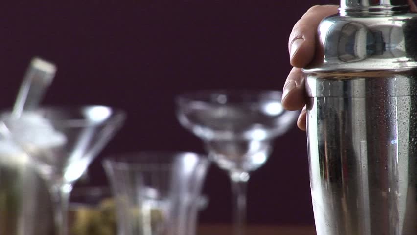 Shaking a cocktail vigorously in a shaker