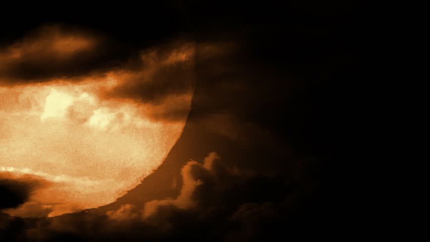 Full moon with dramatic time lapse clouds and air distortion. 