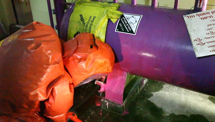 NORTHERN ISRAEL -DECEMBER 17: Firefighters practice to remedy leak accident of corrosive toxic hazardous material Ammonia liquid in seven food factories using protective suites, Northern Israel December 17 2012