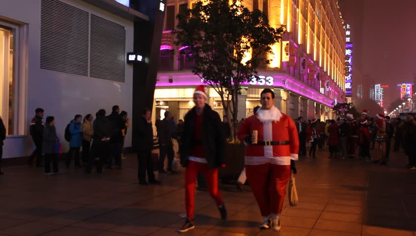 shanghia,China - Dec 15:peoples dressed in christmas clothes,walking through Nanjing Road on 15 DEC,2012 in shanghai,China