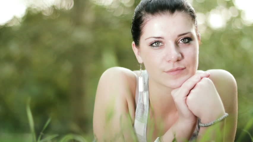 Young beautiful woman daydreaming