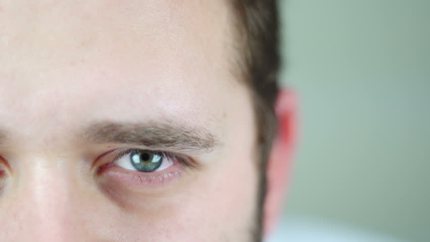SUPER 35MM CAMERA - Young man closing and opening his eyes. 