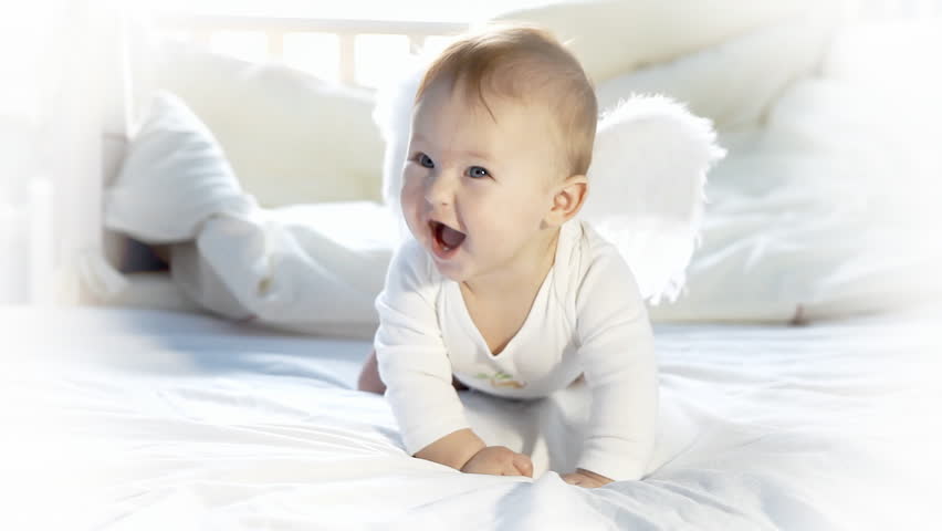 Baby angel on the bed