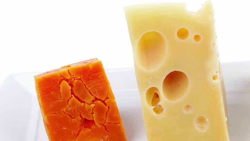 french delicatessen aged cheeses chops served on white plate isolated over white background