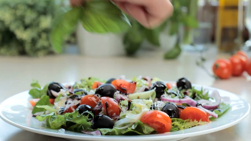 Decorating salad - slow motion, tracking shot