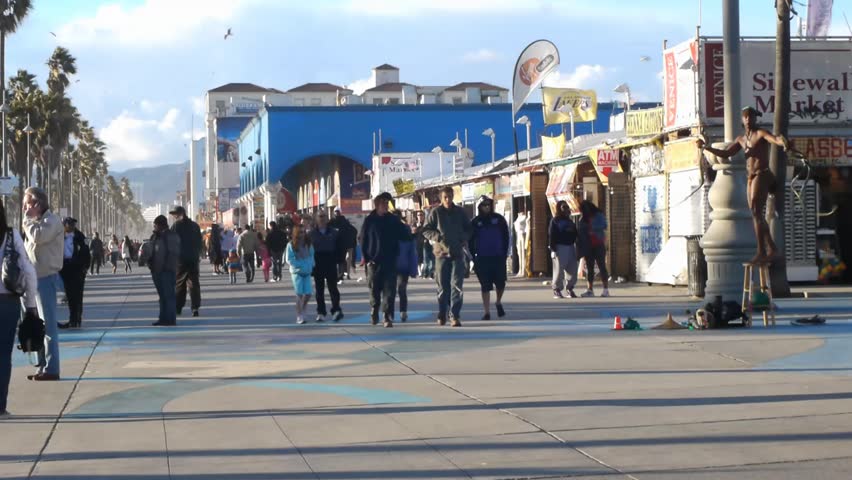 VENICE BEACH, CALIFORNIA - CIRCA 2011:  Tourists and locals walk on the boardwalk at Venice Beach, CA .