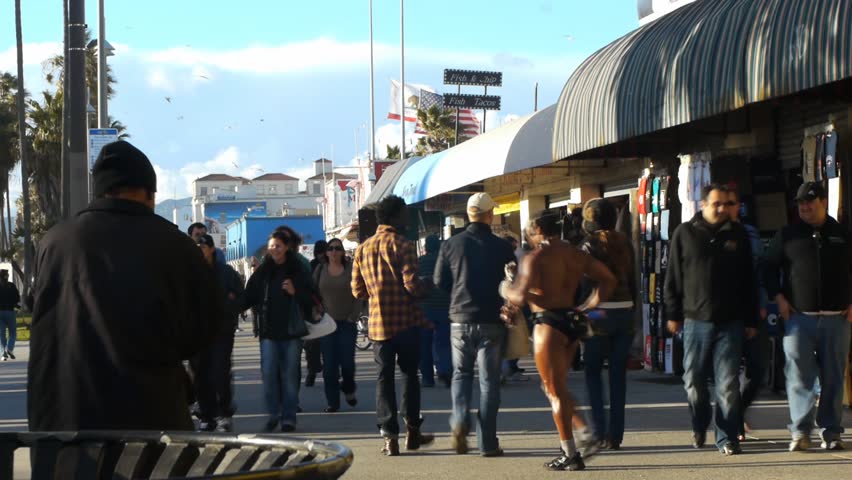 VENICE BEACH, CALIFORNIA - CIRCA 2011:  Tourists and locals walk on the boardwalk at Venice Beach, CA .