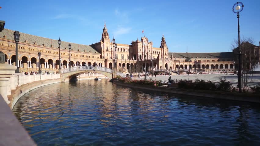 SEVILLE, SPAIN - JANUARY 6: Tourists enjoy a trip on boat on Plaza de Espana Seville on Jan 6, 2013 It was built in 1928 for the Ibero-American Exposition of 1929 designed by architect Anibal Gonzalez