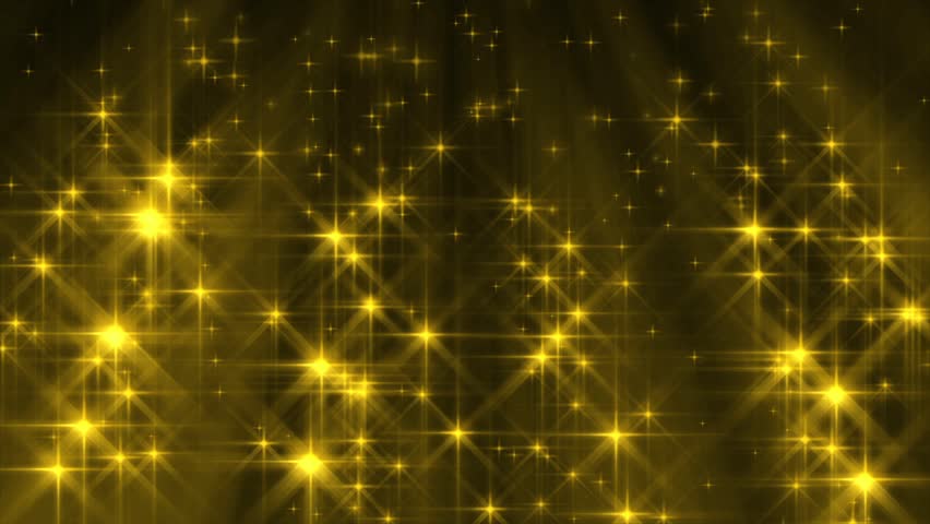 Perfectly seamless loop features colorful golden yellow rays of light behind sparkling star particles falling down from above against a dark and text-friendly background.