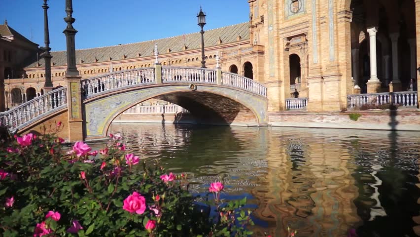 SEVILLE, SPAIN - JANUARY 6: Tourists enjoy a trip on boat on Plaza de Espana Seville on Jan 6, 2013 It was built in 1928 for the Ibero-American Exposition of 1929 designed by architect Anibal Gonzalez