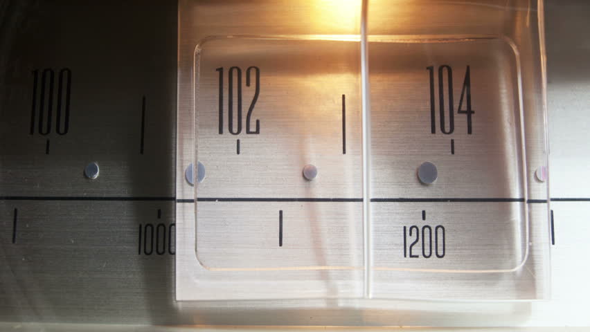 a glowing radio with the marker running through the different stations and frequencies