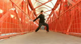 A street dancer performer person dance on a bridge 