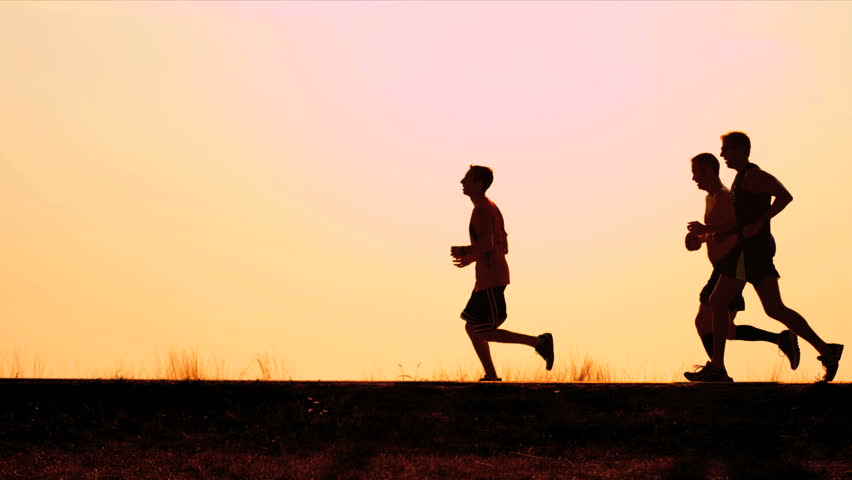 Silhouette of male racing on morning shot on RED EPIC