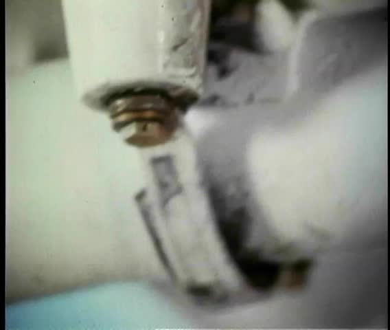 Close-up of loose screws on helicopter landing gear