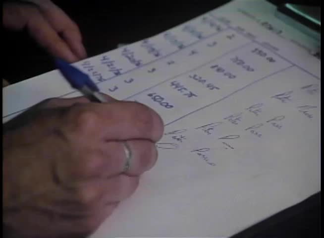 Close-up of hand duplicating signature