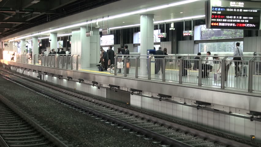 TOKYO, JAPAN - 16 OCTOBER 2012: A Shinkansen bullet train arrives at Tokyo station