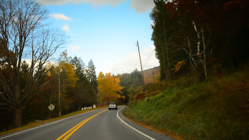 Time lapse of a drive through a hilly twisty road during glorious fall in rural Pennsylvania.  POV.