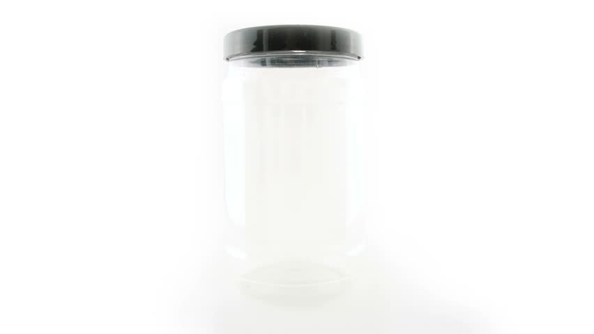 Stop-motion animation of a penny jar going from empty to full.