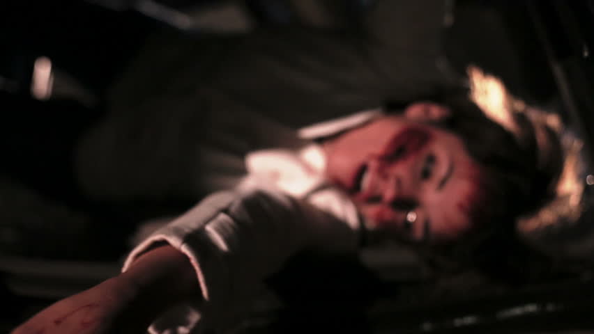 Latin woman screaming for help after had an accident, injured and trapped in her car