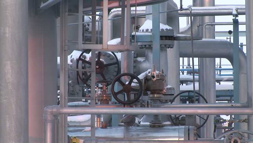 Underground storage of natural gas. Factory distribution, and industrial processing of natural gas with Worker. Many pipelines and construction. 