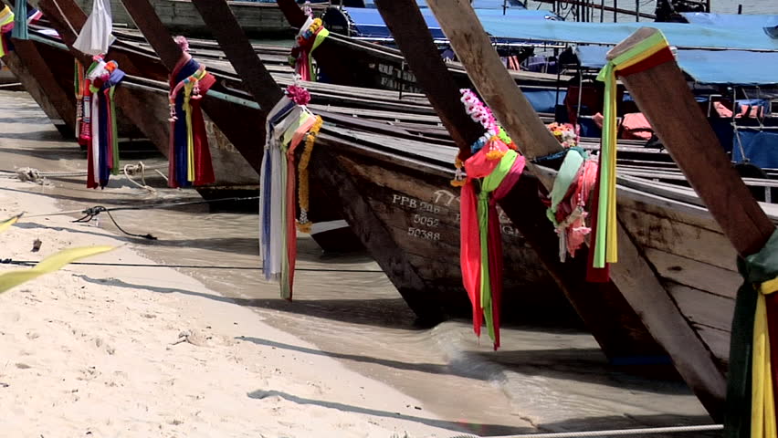 PHI PHI ISLAND, THAILAND - CIRCA FEBRUARY 2009: Decorated Long Boats on Ao Loh Da Lam Beach