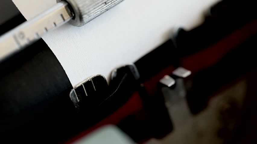 Someone is writing a farewell message with the typewriter to an old love, while a new love is calling.