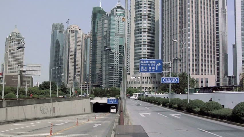 SHANGHAI, CHINA - CIRCA OCTOBER 2007: Underpass Tunnel in Pudong with High Rising Buildings as Background.