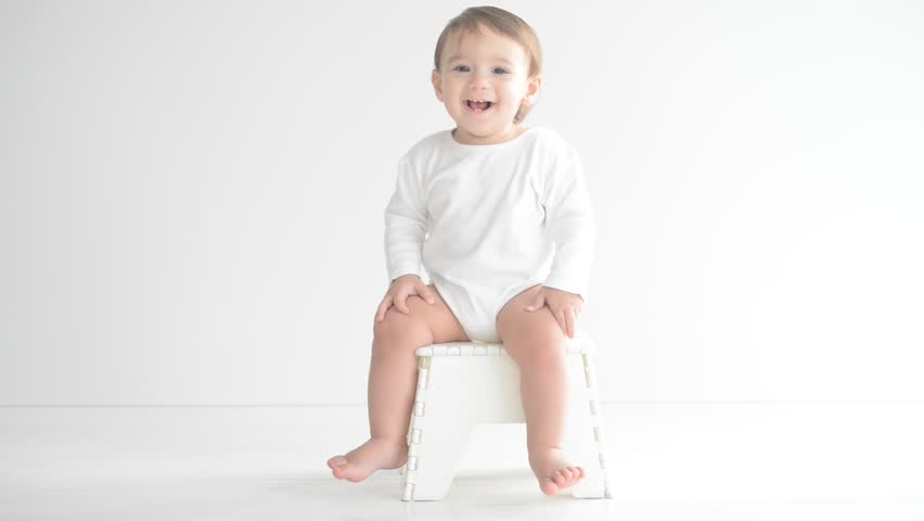 Adorable baby having fun and playing