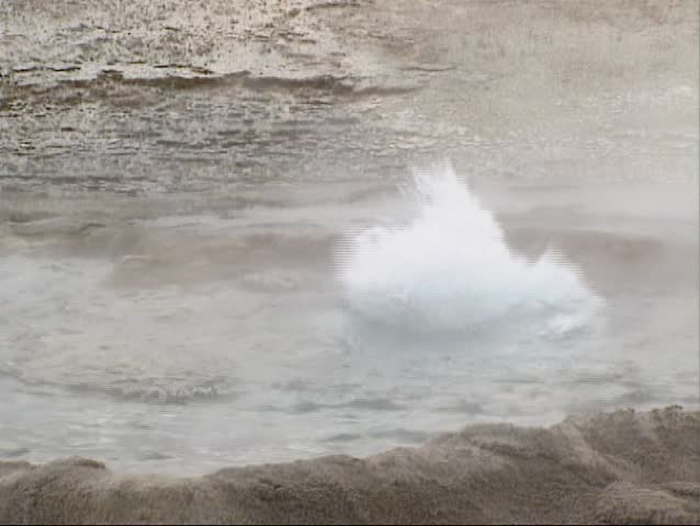 Bubbling water in Cliff geyser, Black Sand Basin, Yellowstone National Park - close up.  Cliff Geyser has a cliff-like wall formed around the crater.