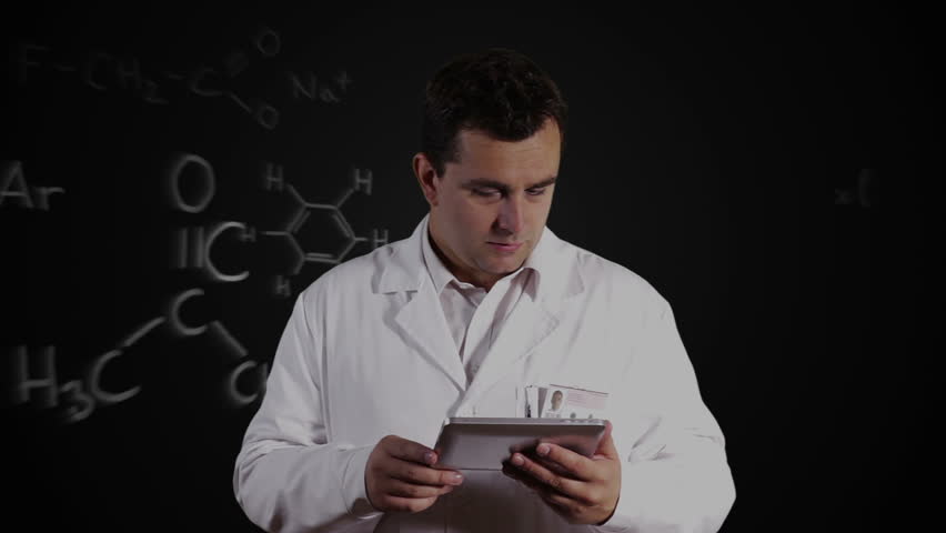 Scientist using Tablet PC with Scientific Chemistry Background