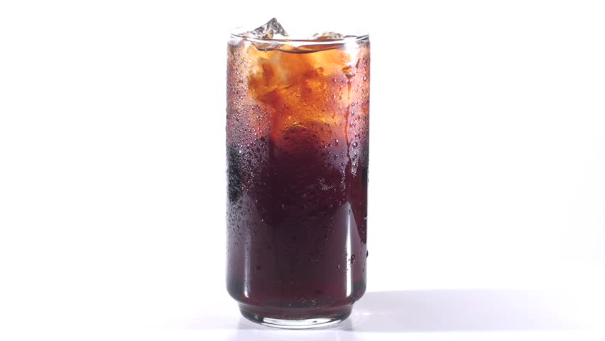 Beverage in glass rotates against white - HD
