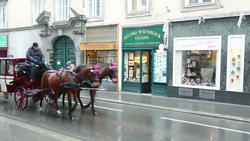 VIENNA- FEB 19: fiacre goes down street the cities of Vienna on Feb 19, 2011, in Vienna, Austria. The word "fiacre" occurred from Hotel de saint Fiacre hotel name ("Hotel of a sacred Fiacre") in Paris