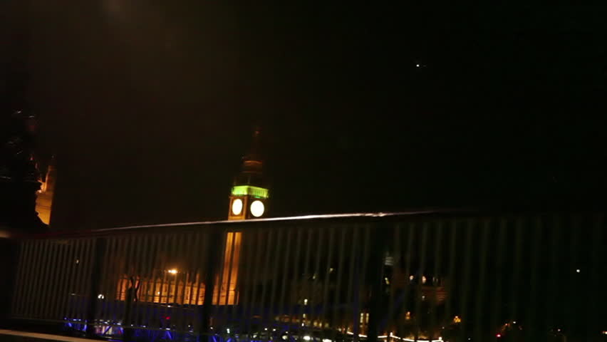A shot of Big Ben and Westminster over a railing in London, England. 