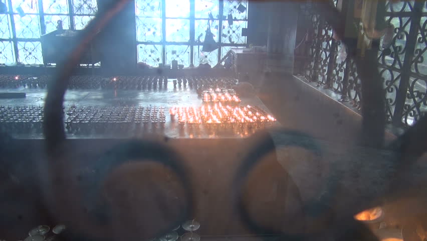 Tibetan buddhist candles in Dharamsala temple, India