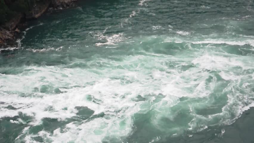 A close view of the rapids of Niagara  Falls before emptying into the falls/Niagara Rapids/ Niagara rapids flow gently